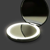 Ella LED Compact Mirror open showing standard and magnified mirrors with adjustable LED light ring.