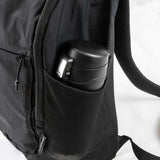 Frontier Trail Daypack side pocket holding a black insulated bottle, showcasing practical outdoor features