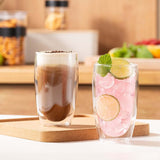 Bodum Pavina Double Wall Glasses Cup - Large - Set of 2 with dessert and drink, showcasing heat-resistant, stylish design.