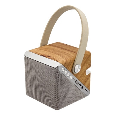 Compact wood-grain-finish speaker charger with grey grille, angled control strip and cream carry loop
