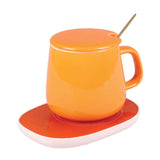 Ceramic Mug Warmer Set featuring an orange ceramic mug with lid on a matching warmer base.