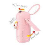 5000MAH Powerbank with CCC showing pull cables and phone stand features in pink color.