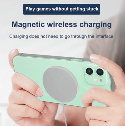 Catalogue illustration of a phone held horizontally with the round magnetic charging puck attached