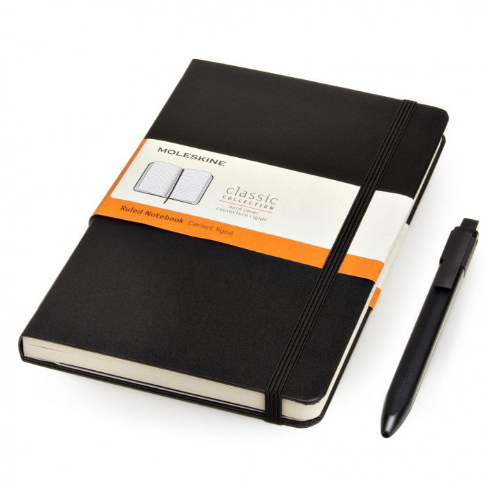 Black Moleskine ruled hard-cover notebook with elastic closure and black click pen alongside