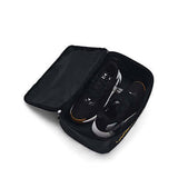 Under Armour Contain Shoe Bag Black with Gold holding sneakers, perfect for athletes and travellers.