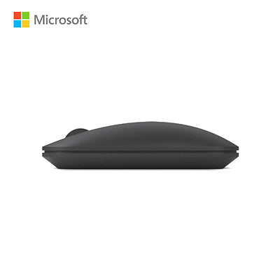 Side profile of black Microsoft Designer Bluetooth Mouse showing its low curved shape