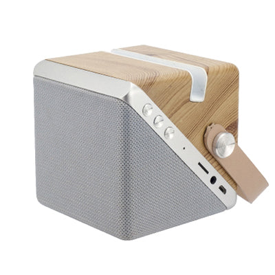 Speaker charger with its carry loop lowered, showing the pale top strip and side controls and ports