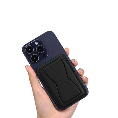 Black folding phone stand and card holder shown against the back of a phone