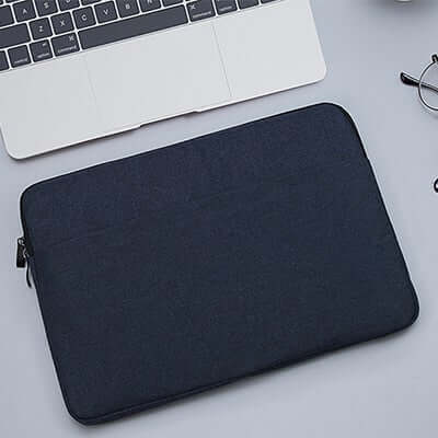 Dark navy-black padded laptop sleeve with zip closure and plain front panel