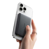 Baseus PicoGo Ultra-Slim Qi2 Magnetic Power Bank 10000mAh 27W attached to phone in hand.