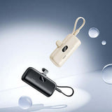 Remax RPP-76 Capsule Powerbank 5000mAh in black and white with bubbles in the background.