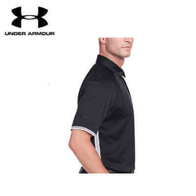 Men’s black Under Armour Corp Rival polo worn in side view showing sleeve and underarm panel