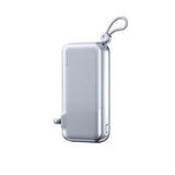 Remax CP-13 Powerbank with Wall Plug 10000mAh in silver with compact design and carrying handle.