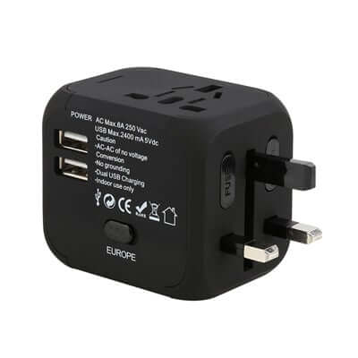 Black four-plug travel adaptor shown with extended plug pins and catalogue specification markings