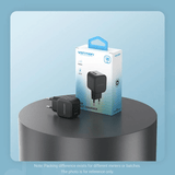 Vention 1-Port USB Wall Charger 18W on a table, perfect for quick charging devices.