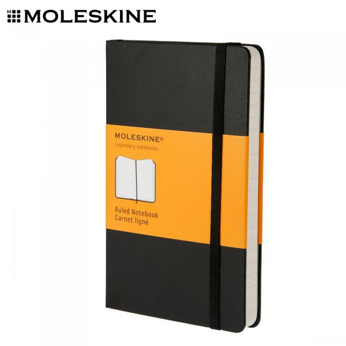 Black Moleskine hardcover notebook with elastic closure and original paper band