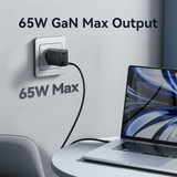 Vention 3-Port USB (C+C+A) GaN Charger 65W plugged into the wall, charging a laptop efficiently with 65W output.