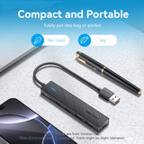 Vention 5-in-1 USB 3.2 Hub 10Gbps on a desk with a pen, showcasing its compact and portable design.