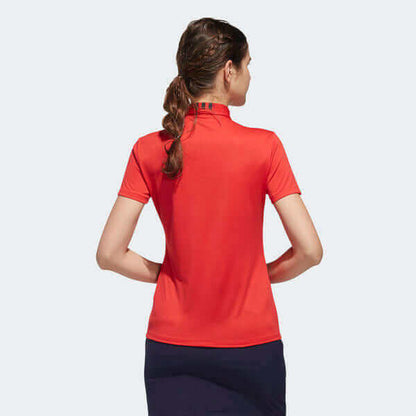 Back view of a woman wearing an adidas Women's Golf Polo Shirt in red, showcasing its stylish design.