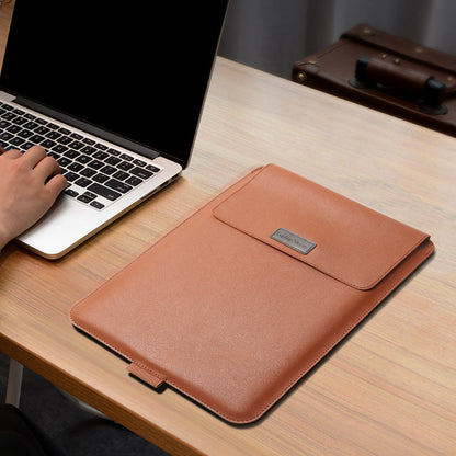 Orange-brown laptop sleeve closed beside an example laptop on a desk