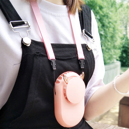 Person outdoors wearing the pink oval rechargeable fan on a neck strap