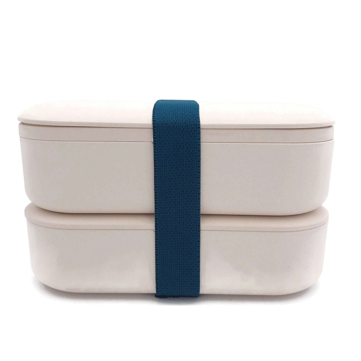 Beige two-tier lunch box stacked closed with a dark blue securing band