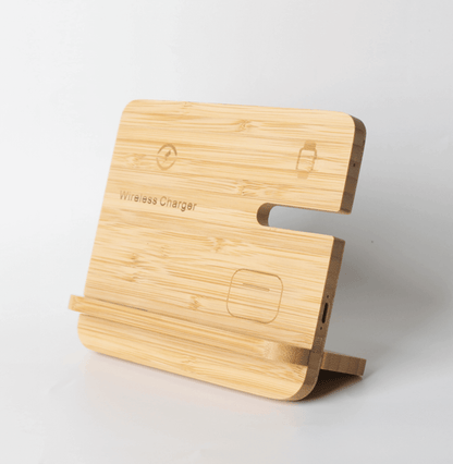 Bamboo-faced charging stand with rounded corners, phone ledge, side slot, device position symbols and a rear support foot