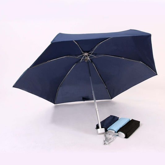 Navy mini umbrella viewed from underneath with three compact folded examples in navy, light blue and black
