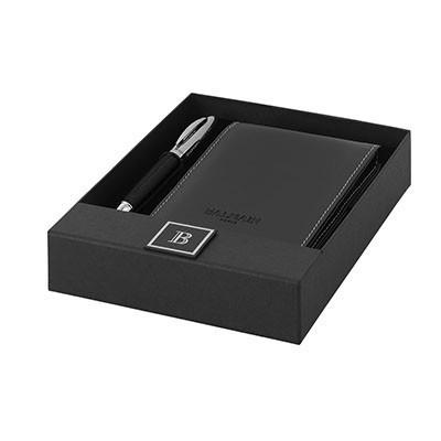 Balmain dark pocket notebook and matching ballpoint pen arranged in a black presentation box
