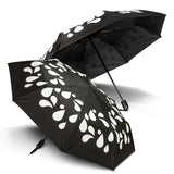 Colour Changing Compact Umbrella with black design and white droplets, ideal corporate gift in Singapore.