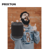 A person holding a Prixton Dance Box Speaker, showcasing its portability and stylish design.
