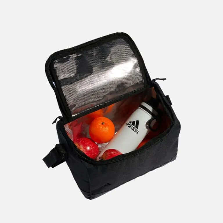 adidas Cooler Bag filled with fruits and a drink, showcasing its stylish and functional design.