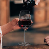 Luigi Bormioli Optica Bordeaux Glass filled with red wine, perfect for a corporate gift Singapore.