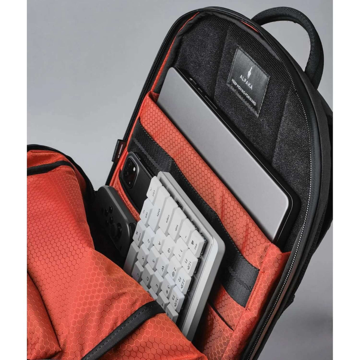 ALPAKA Elements Backpack Pro interior with laptop sleeve and compartments for tech accessories.