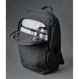 ALPAKA Bravo Backpack 23L black interior view with open compartment and organizational features.