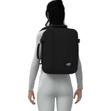 Cabinzero Classic Backpack 28L on a model's back, showcasing sleek design and functionality for travelers.