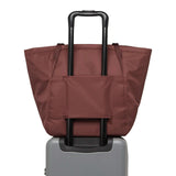 Herschel Joana Foldable Tote Bag displayed on a suitcase, showcasing its modern design and eco-friendly materials.