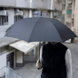 Brand Charger Vireo One Ultra Light Umbrella in use, featuring a sleek black canopy, perfect for corporate gifting.